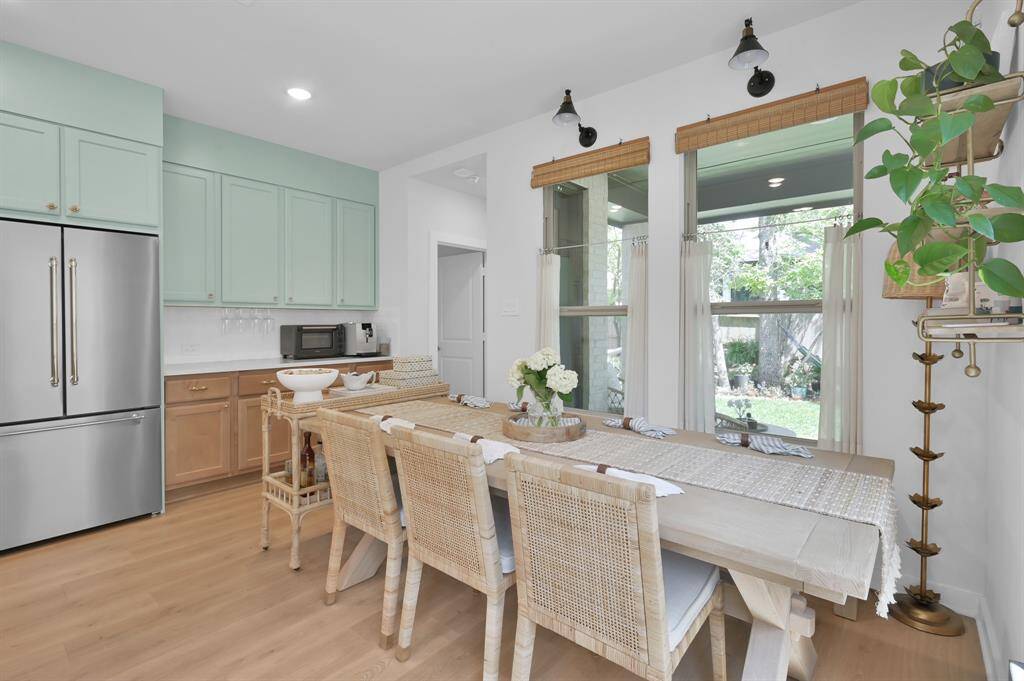 The breakfast area features additional counter / cabinet space. Perfect for storing small appliances and would make for a great coffee / wine bar. Plenty of space for a large dining table.
