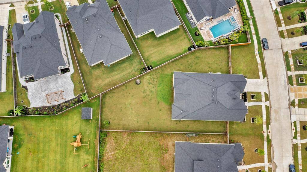 The area features well-maintained lawns, fenced yards, and several ponds, offering a peaceful, family-friendly environment with scenic views.