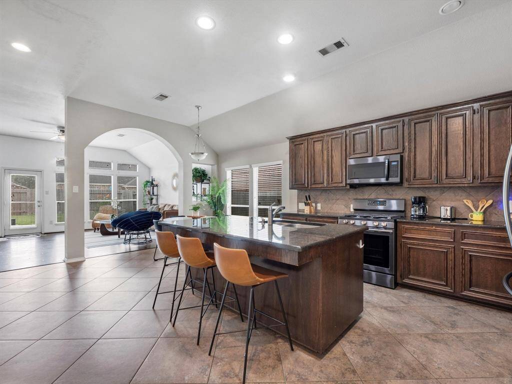 Kitchen is open to breakfast table and living room