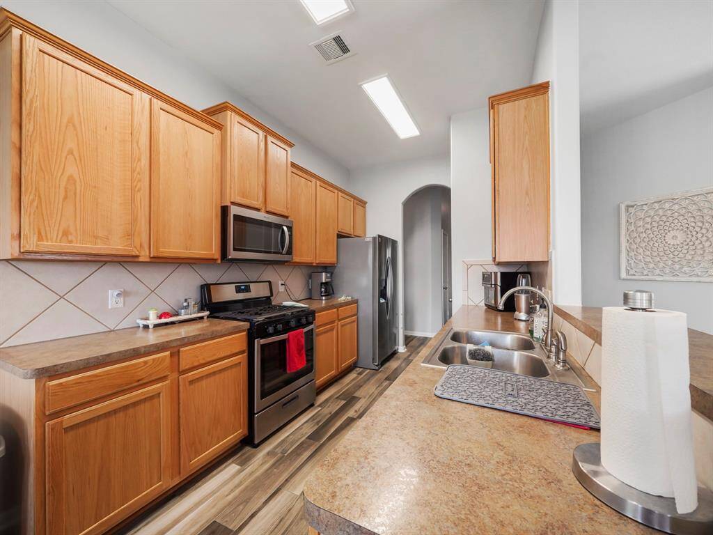 Alternative view of the kitchen showcasing the cabinet and counter space!