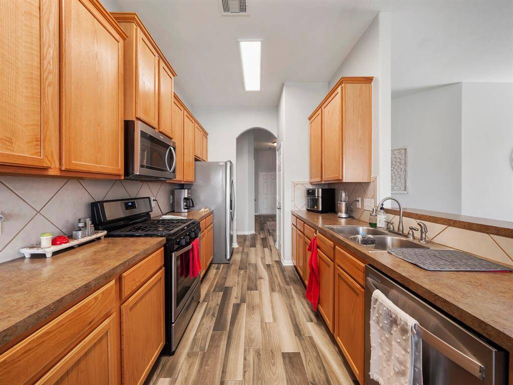 Alternative viw of the kitchen showcasing the arched entryway!