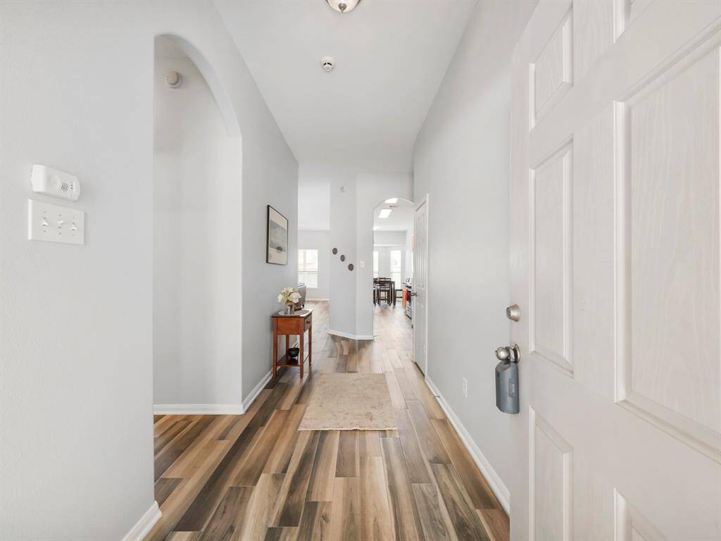 Gorgeous interior has been completely repainted from baseboards to ceiling! The wood-like tile flooring is throughout the home. No carpet!