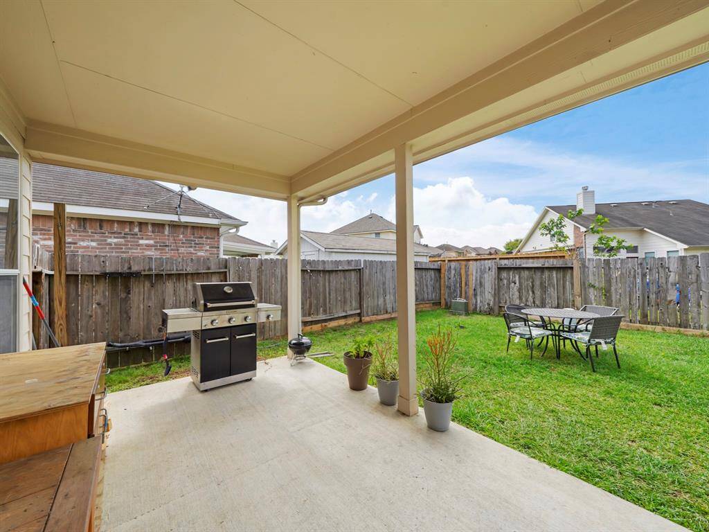 Large covered patio is perfect for grilling and outdoor furniture!