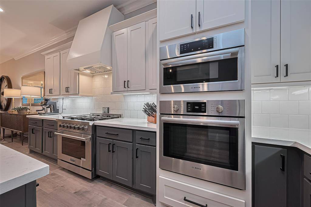 Premium kitchen appliances with custom range and venthood