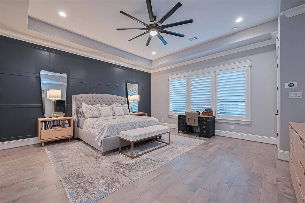 Primary bedroom with upgraded panel wall