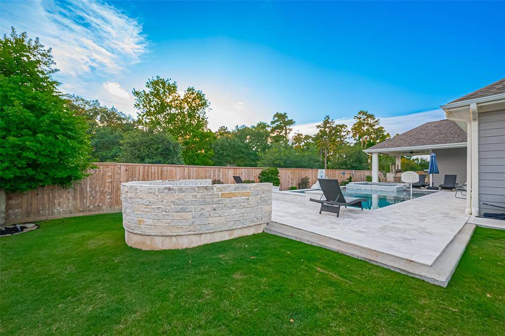 Attached poolside seating area with fireplace