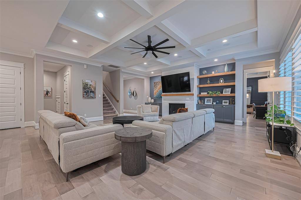 Kitchen side view to custom fireplace and built-ins