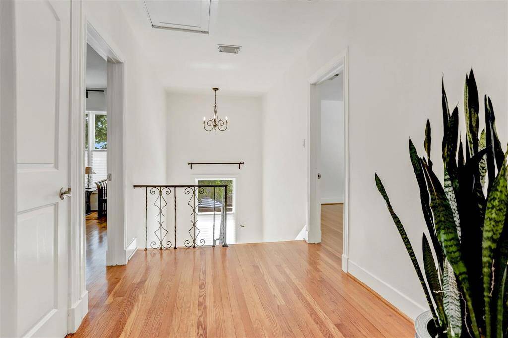 Spacious landing at the top of the stairs at the center of all of the bedrooms features a nicely sized linen closet.