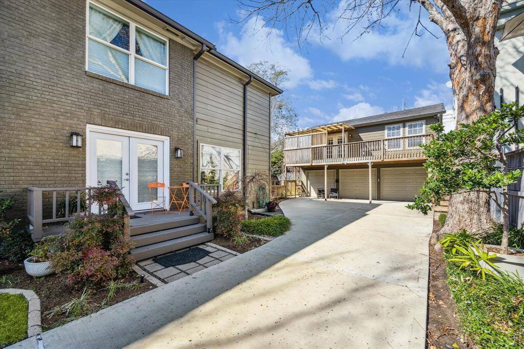 Three car garage topped by 609 sq ft income producing apartment or guest quarters