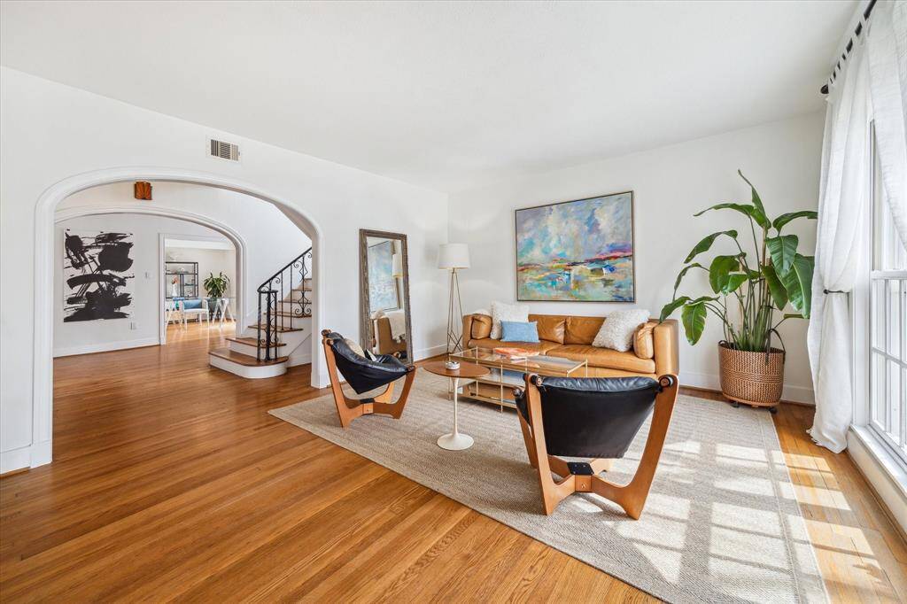 Formal Living Room viewed from front entrance boasts period archways.