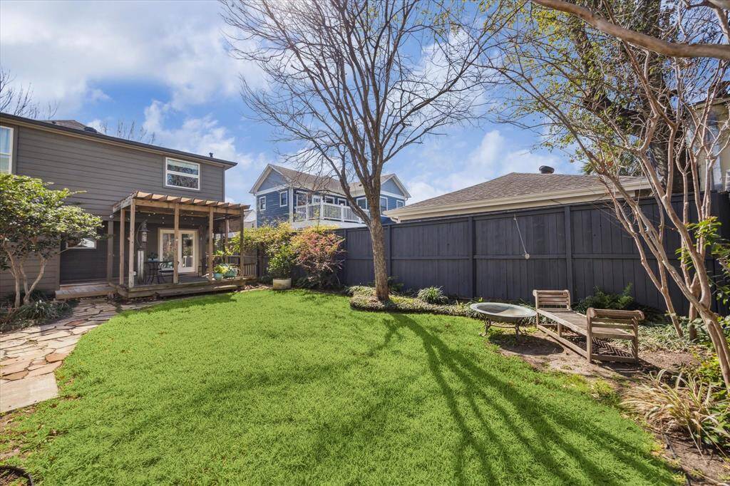 Spacious fenced backyard is serene and can accommodate a pool.