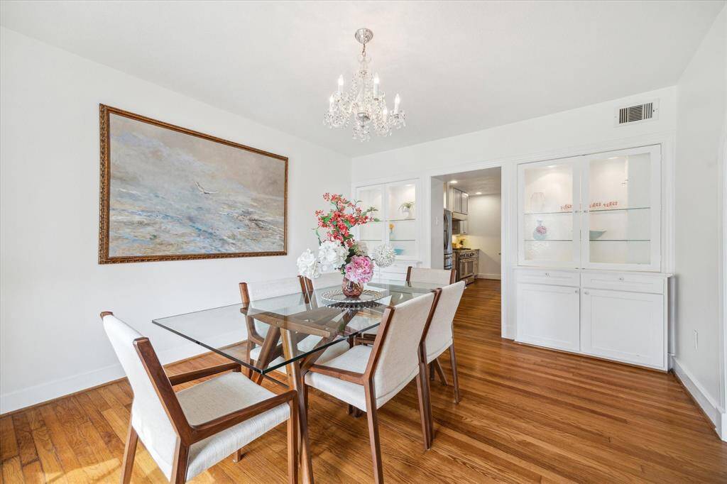 Formal Dining Room entry to Kitchen surrounded by seeded glass cabinetry.