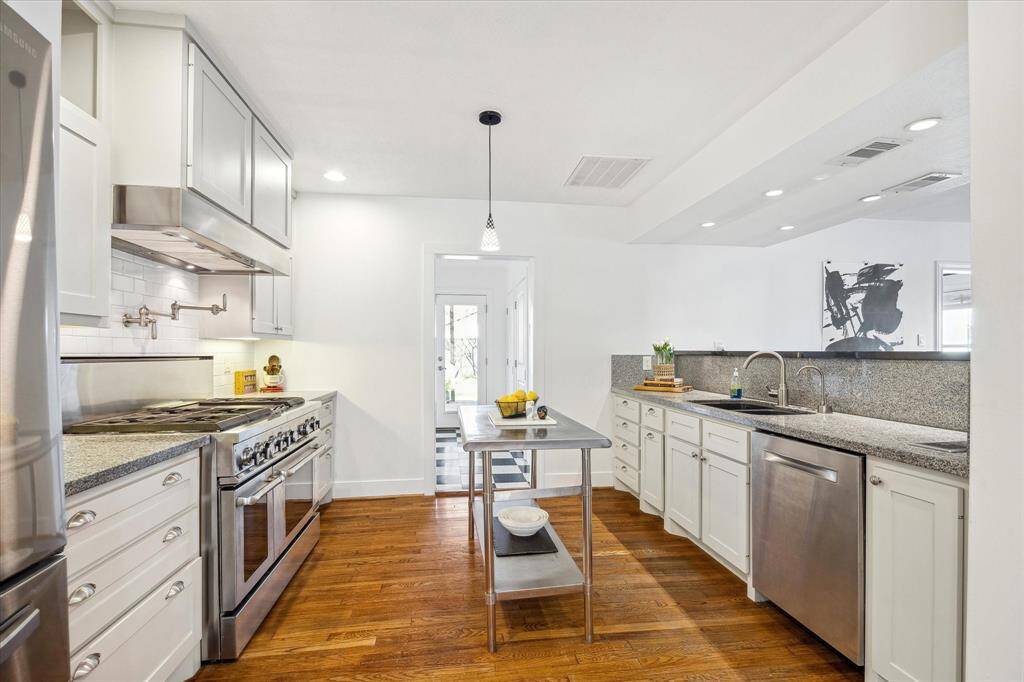 Kitchen viewed from Formal Dining Room showcases high end, energy efficient appliances