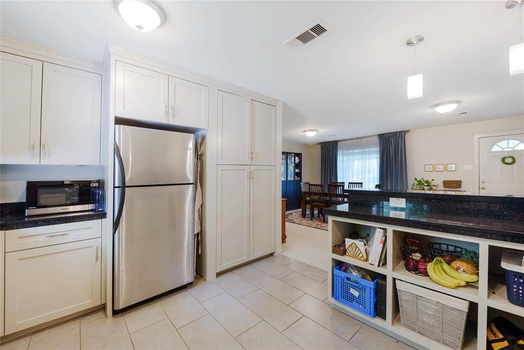 Kitchen opens into dining/living areas.