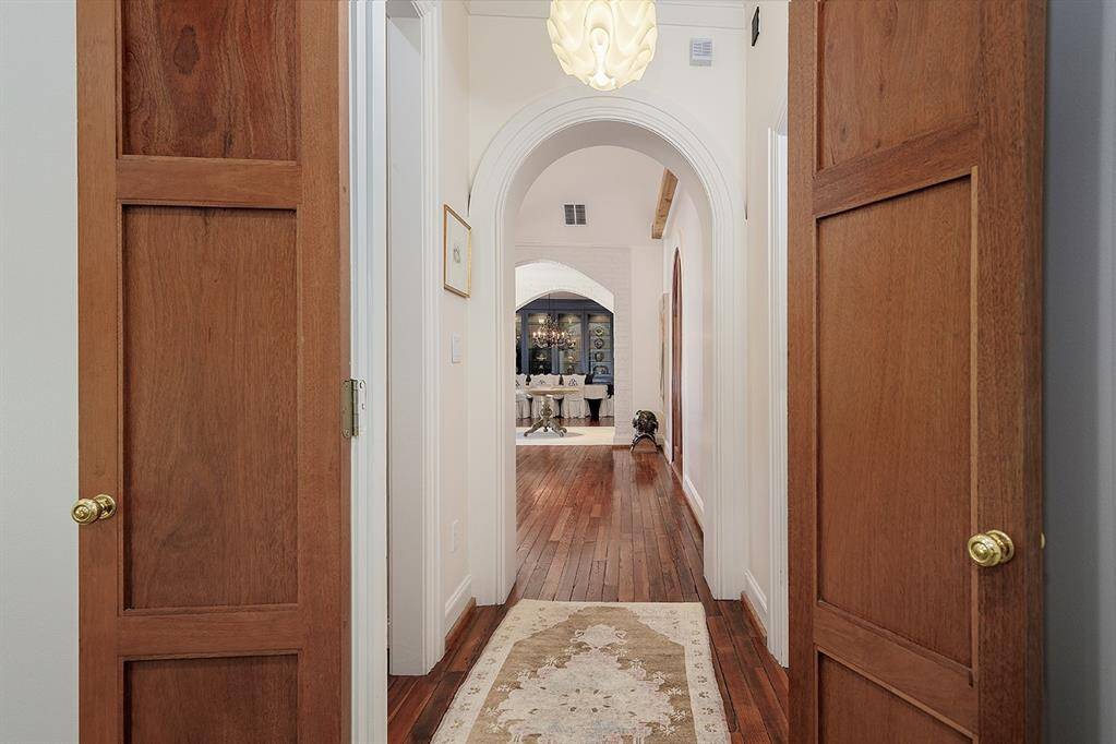 Lovely archways throughout the home! These dual entry doors lead to the primary suite.