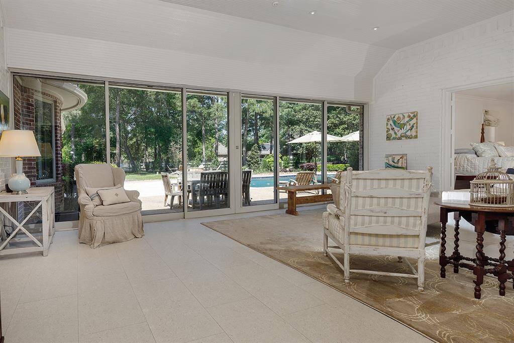 A view of the new glass Nano doors that open to the patio, fire pit and pool.