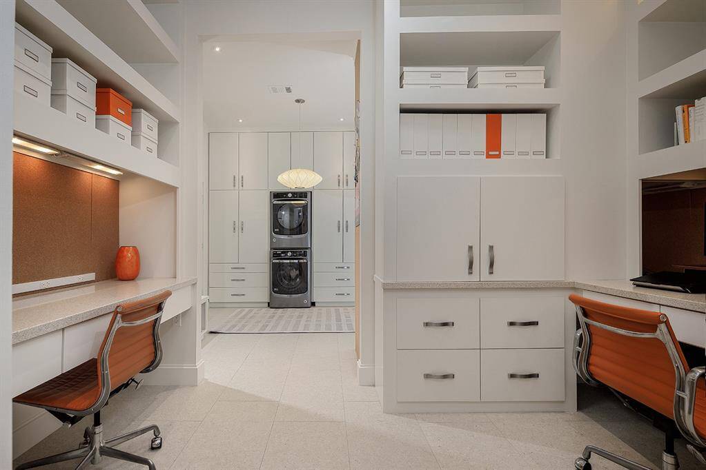 Pass through the built-in study nook to find a fabulous mud room with incredible storage, a 2nd refrigerator, washer and dryer.