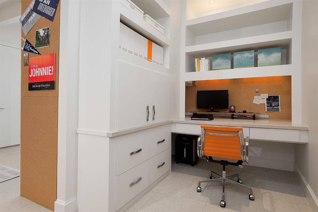 Built-in study nook for two with storage can be closed off for privacy with the sliding barn door