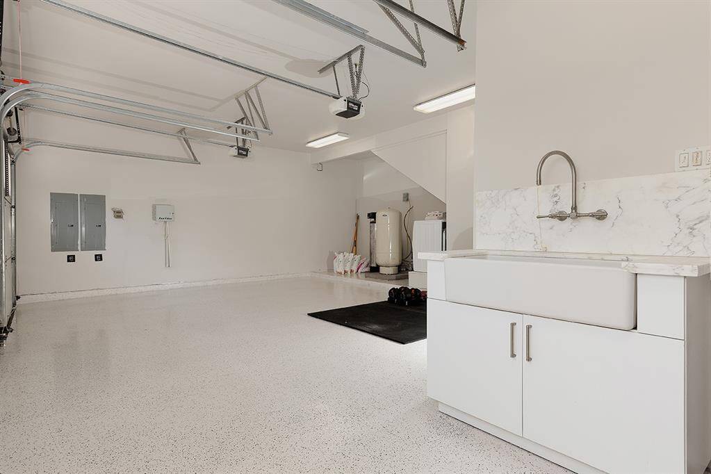 The 2.5 car garage with sink, epoxy flooring and reverse osmosis system is just one area to house your cars.