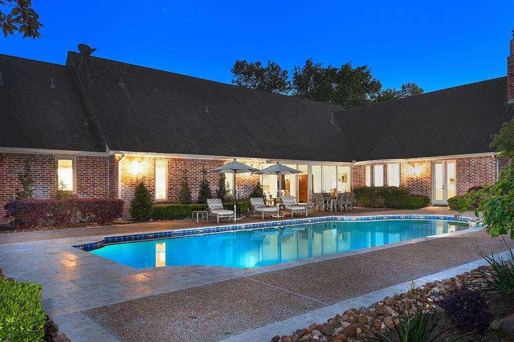 The sparkling pool can be accessed from the kitchen/family room or through Nano doors in the sun room.