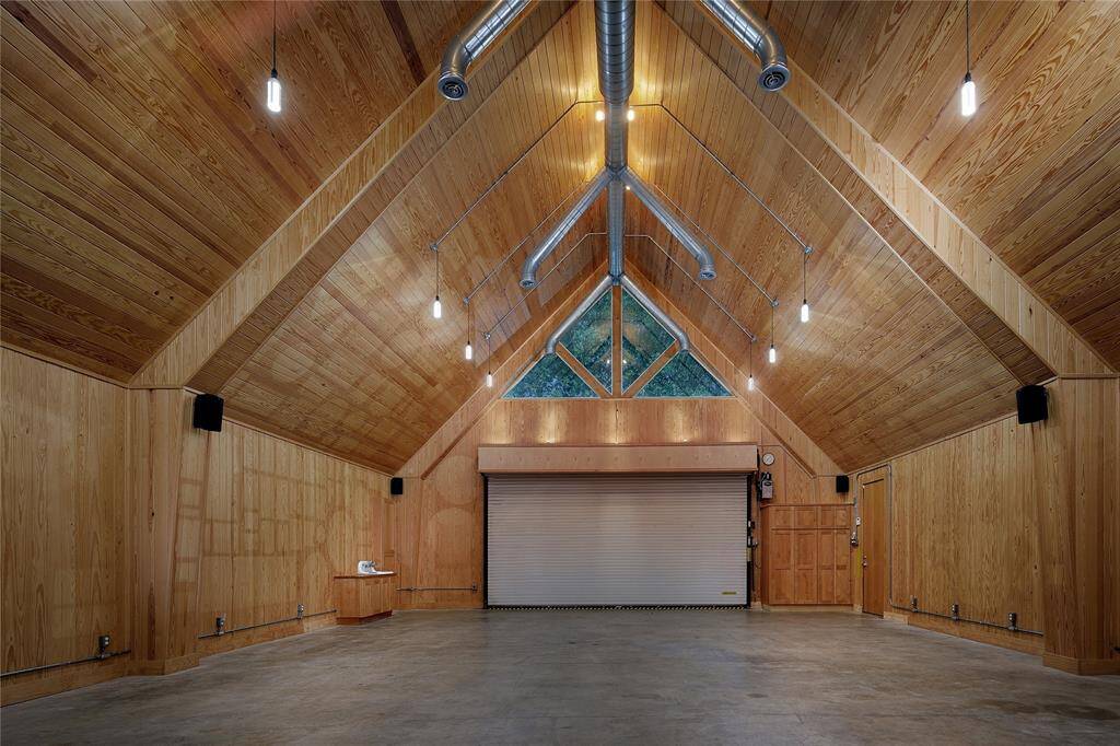 Over 4,000 sf barn with bathroom, washer/dryer hookup, workshop, storage, and space to house 8 cars!
