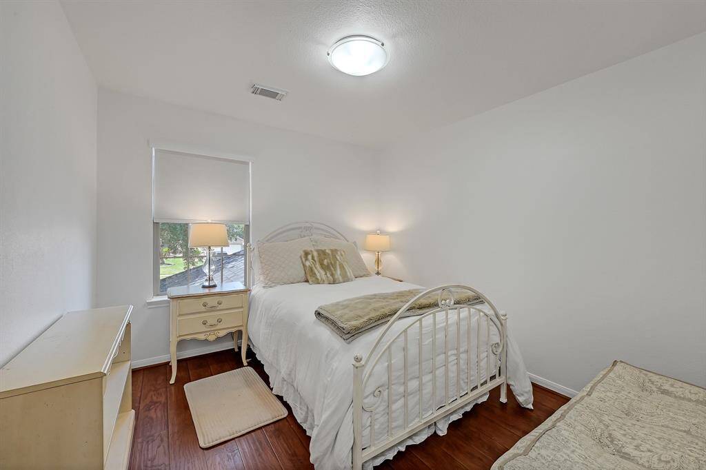 The Third Bedroom at 21215 Bridge Springs Ln, is a great space. The upstairs of the home has no carpet, and it features engineered wood floors guaranteeing a cozy feel to the upstairs. The paint is a bright color. The window has a gorgeous light filtering roller shades in Serene White in the whole home.