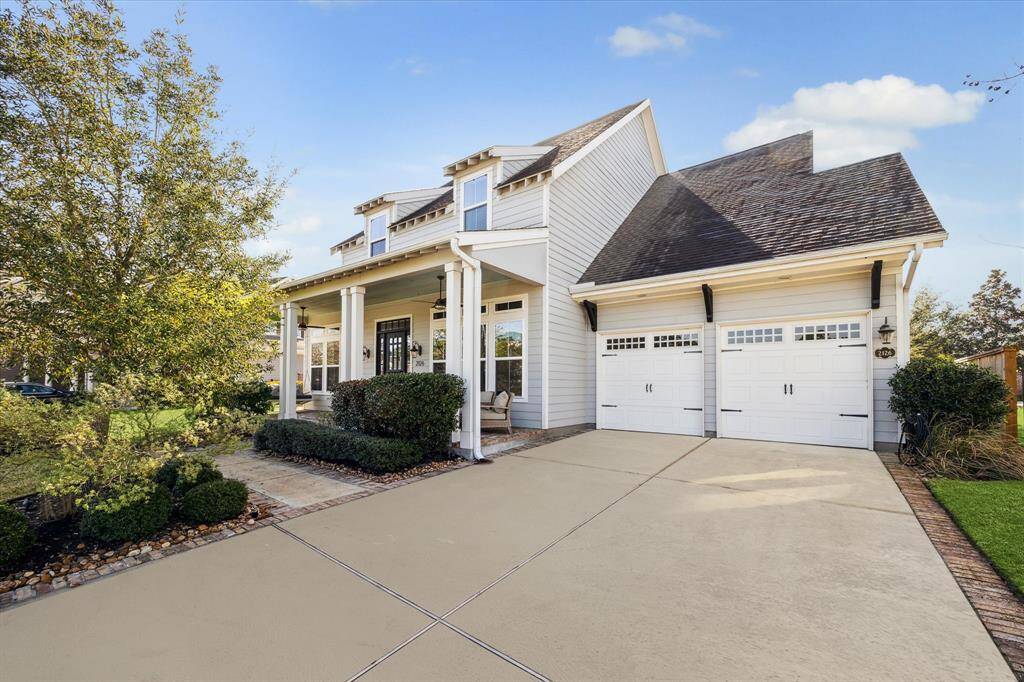 Home features an oversized, double wide driveway and a 3 car tandem garage. Photo has been virtually enhanced.