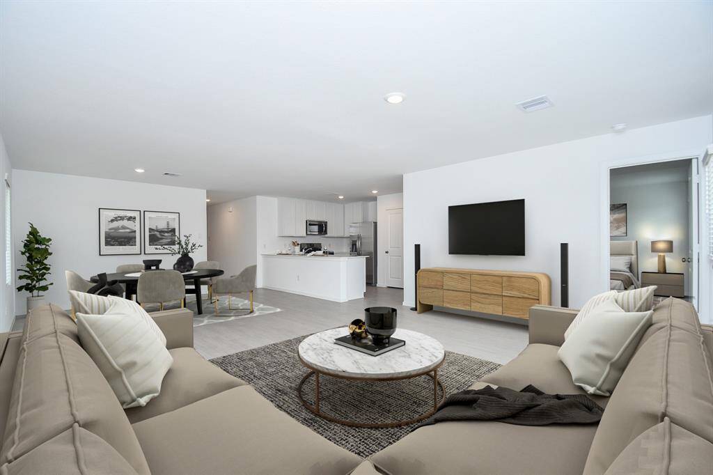 A beautiful peninsula is the onlyseparation from your openconcept dining and living spaces.