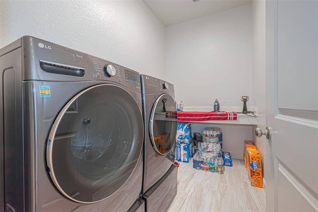 The spacious utility room helps you fold and sort laundry with ease, craft or wrap gifts, or tackle other projects.  It comes equiped with gas or electric dryer connections.