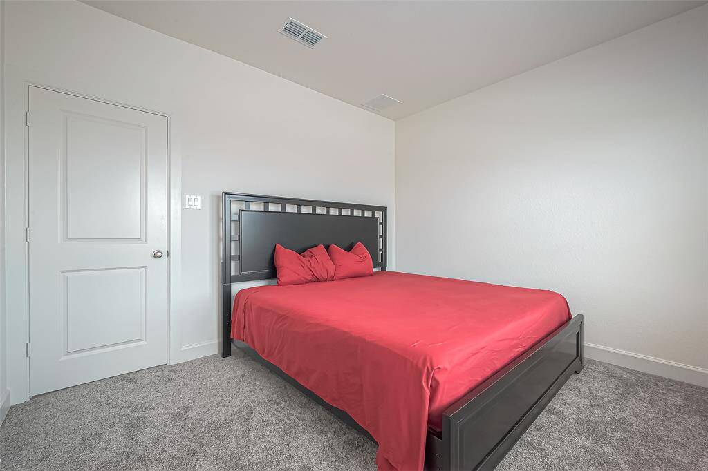 This secondary bedroom is located upstairs and also has ample room and closet space.