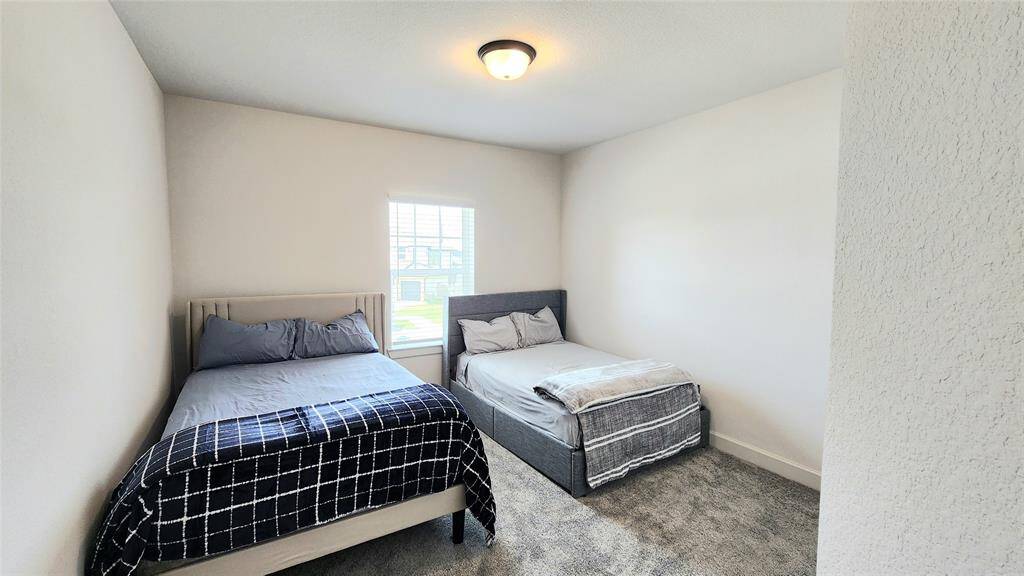 This secondary room currently has two double beds and still more space available.  It is located upstairs.