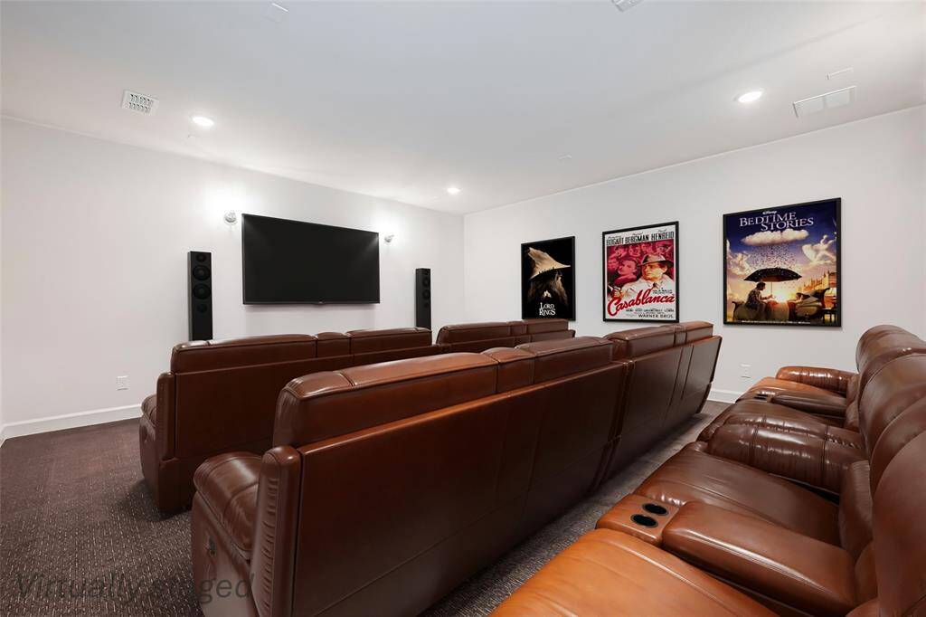 Experience ultimate entertainment in this state-of-the-art media room, wired for surround sound and projector, and outfitted with wall sconces.  Carpets have additional padding.  It is the perfect place for movie nights, sporting events, and gaming.
