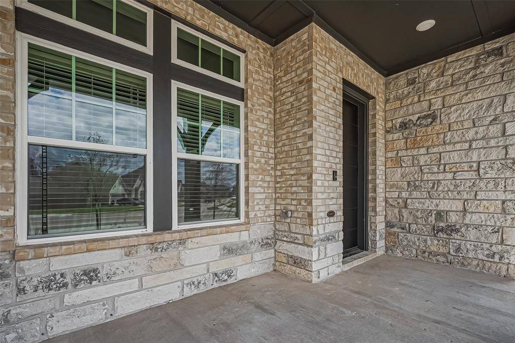 Front covered patio provides a tranquil space for sipping your morning coffee or enjoying a beverage.