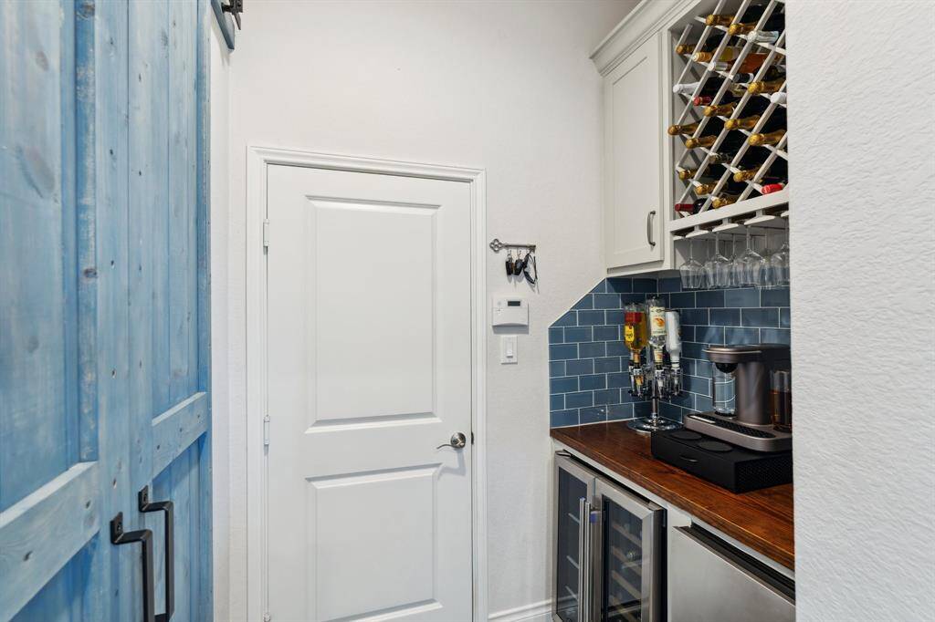 When you walk through the open door from the living room you can either turn left to go outside or straight ahead is a secondary en-suite bedroom.