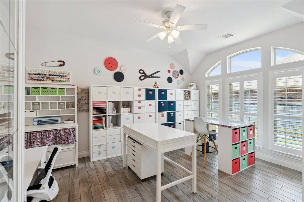 Originally two bedrooms, this expansive area was opened up to create a large flex room—perfect for a craft studio, playroom, or home gym.  The open door is one of three full bathrooms in the home.