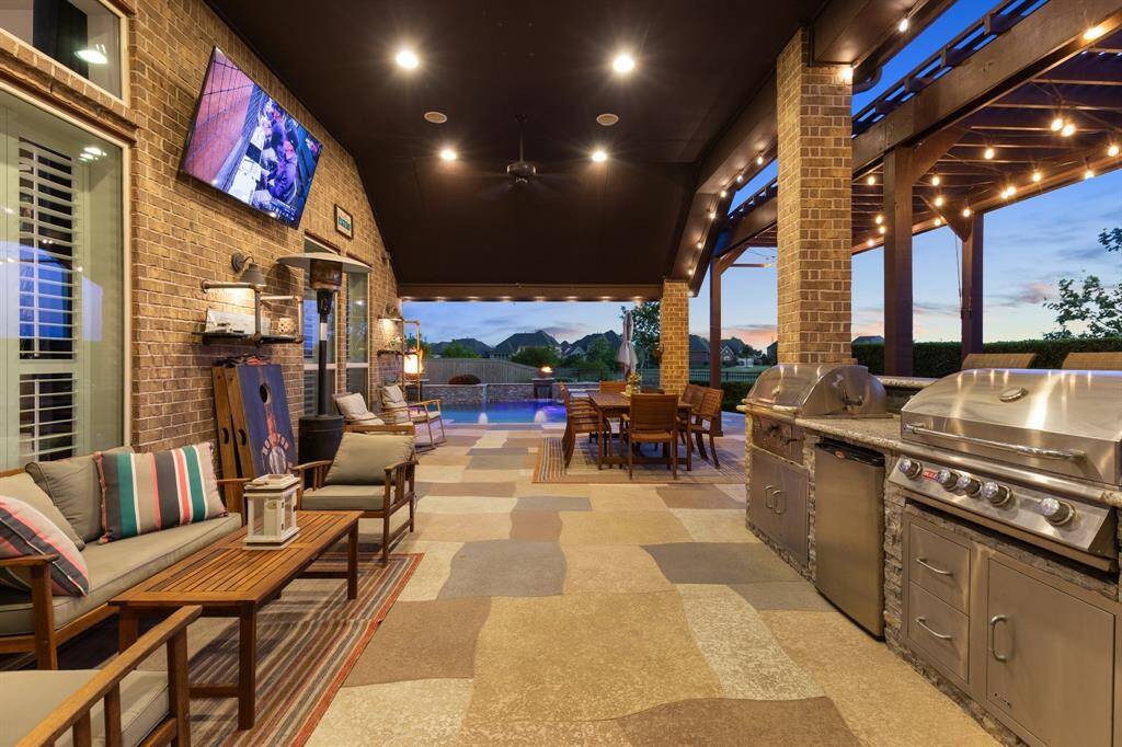 Elegant curb appeal meets modern luxury in this beautifully maintained single-story home featuring a spacious 3-car garage, manicured landscaping, and inviting entryway lighting.