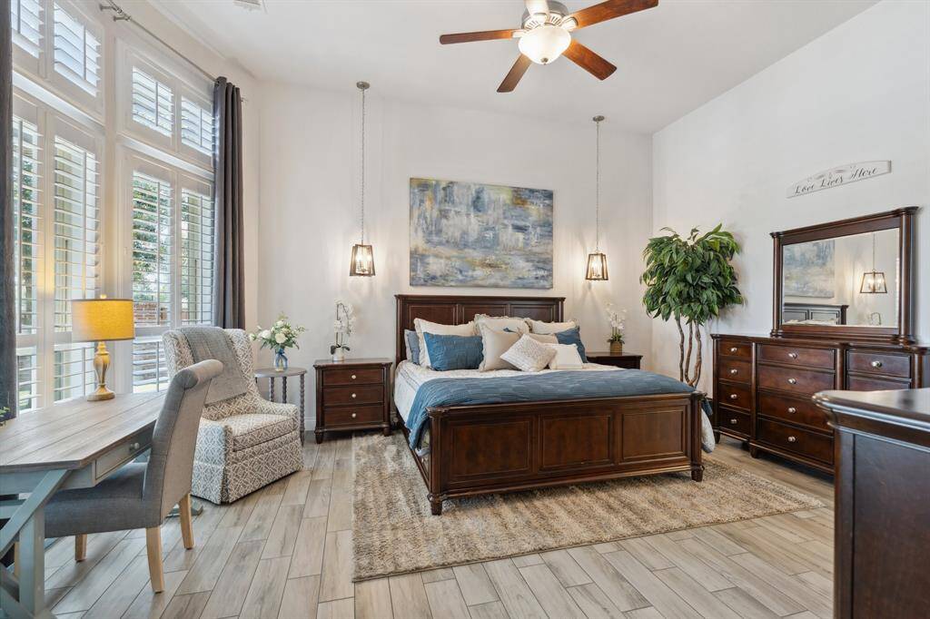 Look at this gorgeous Primary suite!  The wall of windows ensures plelnty of natural sunlight into the room.
