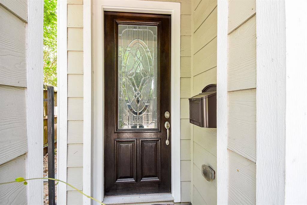 Upon entry, you're greeted by a hall flanked with generous windows.