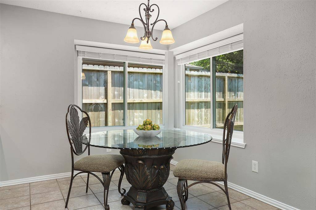 Enjoy your intimate meal in this bright breakfast nook while watching nature through these large windows.