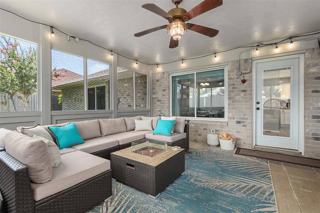 Another view of the screened in patio looking through the large, updated windows into the den and kitchen.