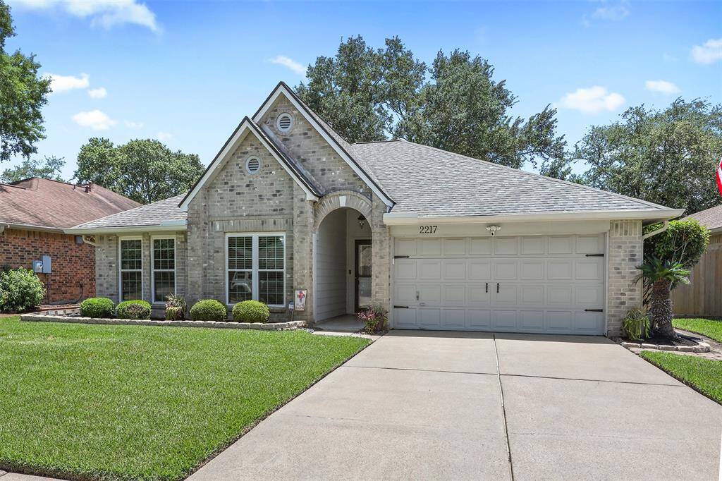Double wide driveway with one garage door. Epoxy flooring was added in the garage in 2024 and new garage door opener with battery backup & exterior keypad installed in 2025.