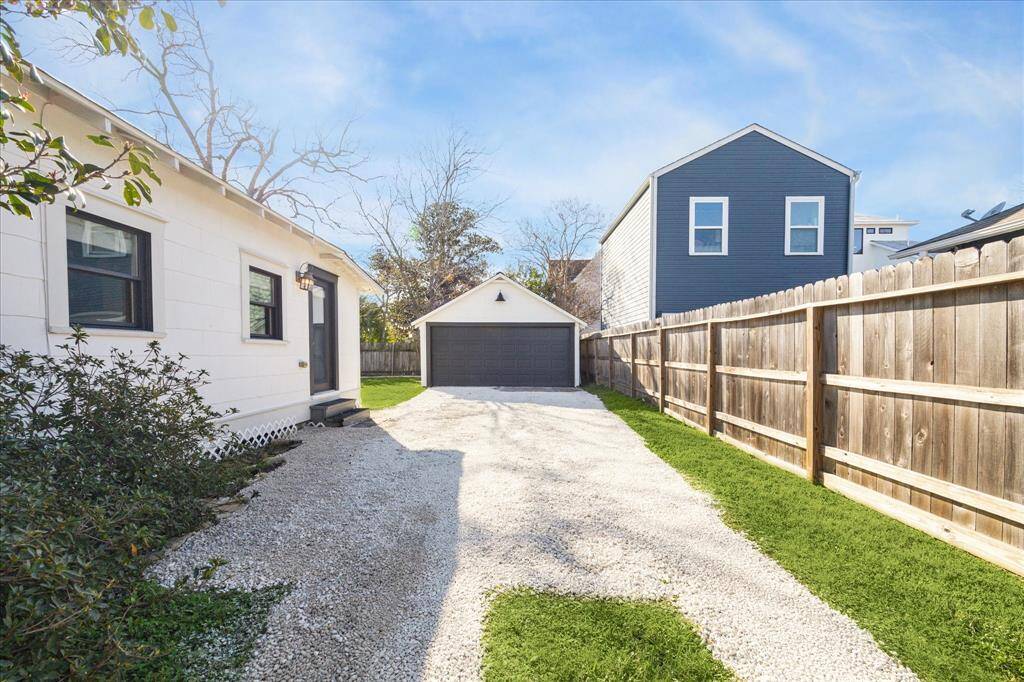 Back door leads to your large driveway which provides parking for a few cars behind the automatic driveway gate, in addition to your 2 car garage