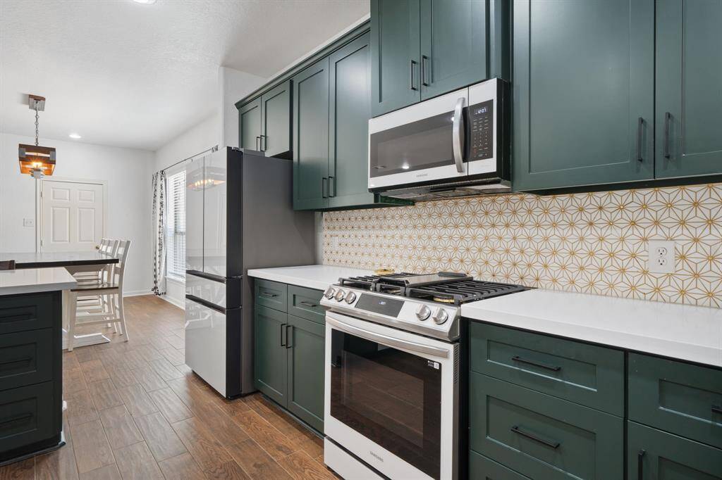 The dining area conveniently off the kitchen is perfect for your family meals!