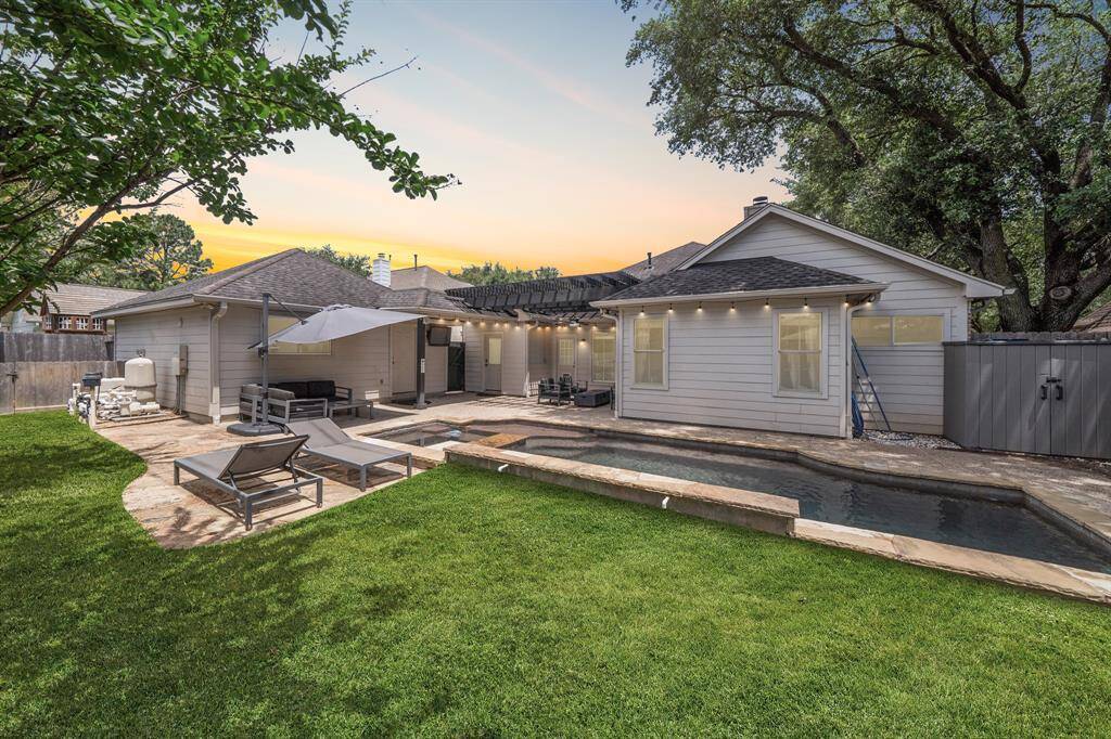 Never have a reason to leave your home again! This home is like a vacation within itself! Look at your backyard oasis! This backyard offers tons of green space, an INCREDIBLE sparkling pool, and a covered patio, perfect for relaxing and entertaining family and friends!