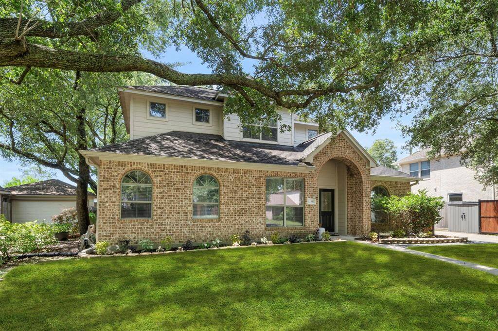 This impressive home has fantastic curb appeal! Highlighting beautiful brick and wood exterior, a double-wide drive way, well maintained lawn and beautiful landscaping on a quiet street.