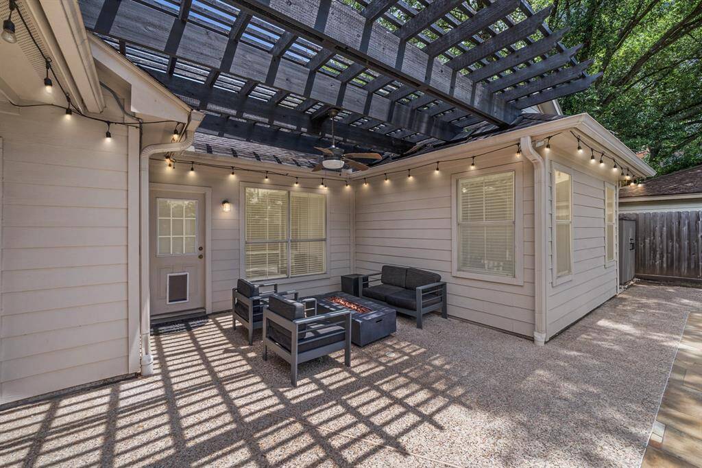 Get out from under the Texas sun, but still enjoy the great outdoors under this amazing covered patio!
