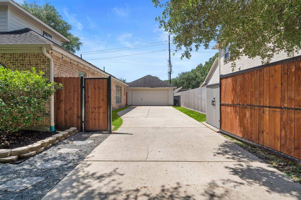 Nestled behind private gates, this beautiful home features an extended, welcoming drive way.