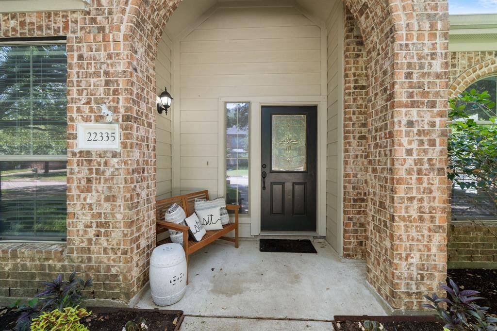 Relax on the cozy covered front porch and enjoy the lush front yard landscaping!