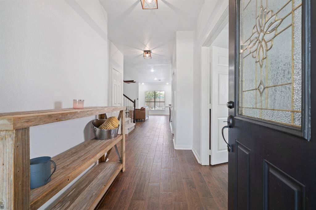 This gorgeous home has an inviting entrance that welcomes your family, friends, and guests.