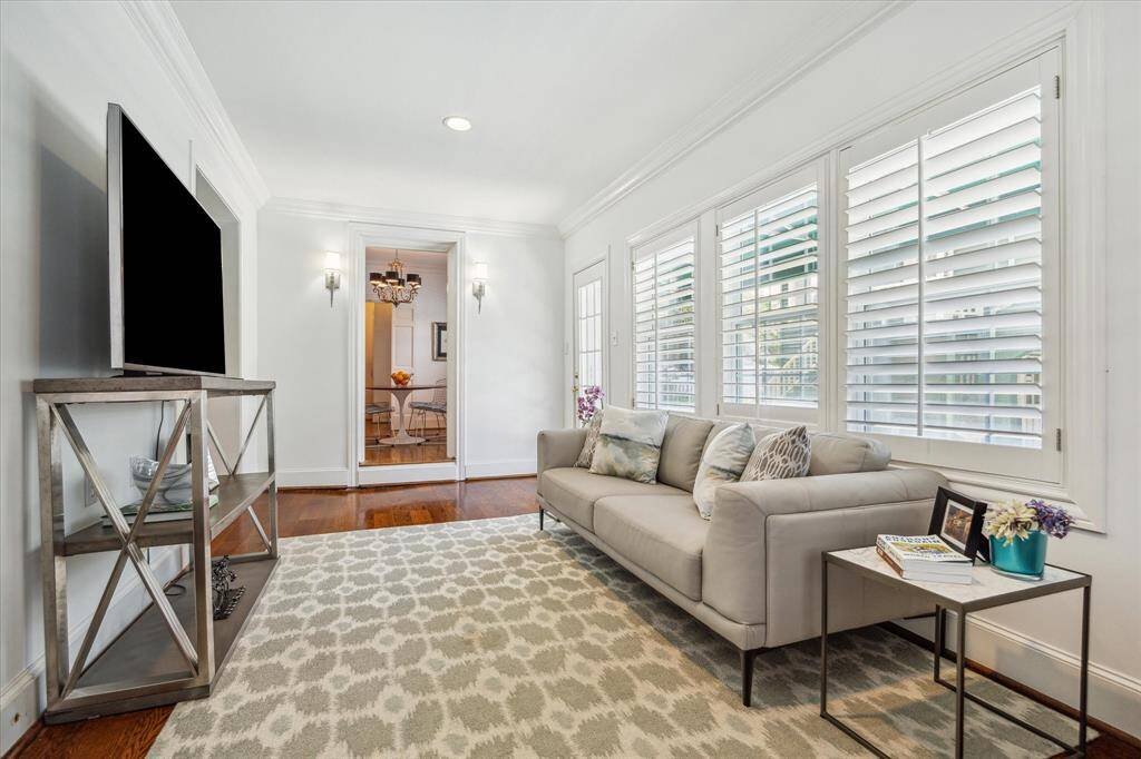 This image captures the flex room with the cased opening in center frame leading to the breakfast room.